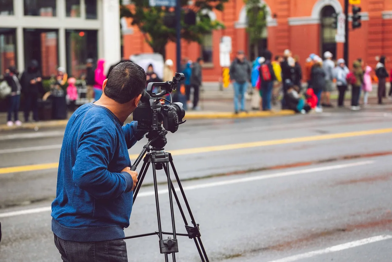 camera, man, person, street, video, negative space, empty, outdoors, city, alone, guy